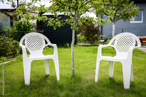 Two plastic chair in garden