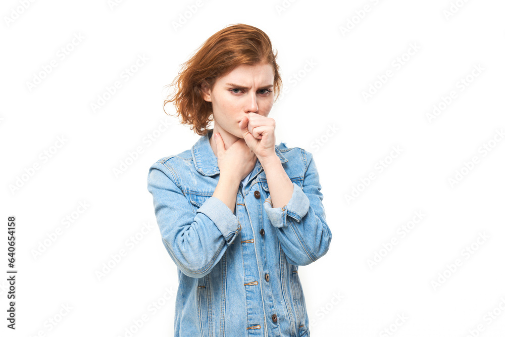 Portrait of young redhead woman coughing, suffering from sore throat isolated on white studio background. Respiratory disease concept