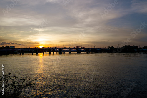 Sunset silhouettes on Binh Trieu bridge in Ho Chi Minh City