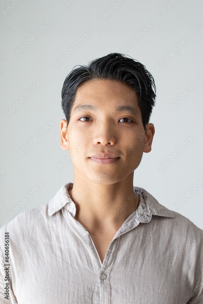 Portrait of a smiling young Asian boy. Close up isolated on white background Portrait of a smiling young Asian boy. Close up isolated on white background