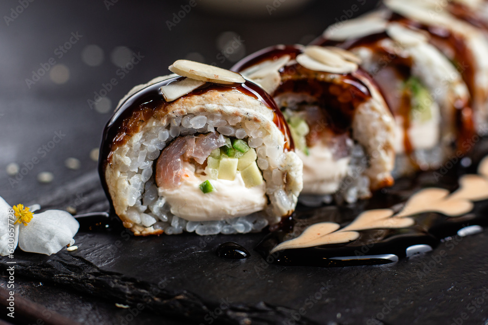 Various Sushi, rolls on a dark background Various Sushi, rolls on a dark background