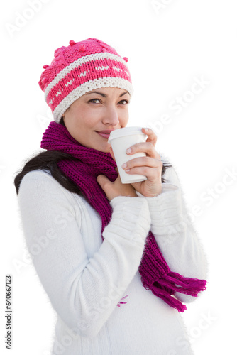 Digital png photo of happy caucasian woman in warm clothes with hot drink on transparent background © vectorfusionart