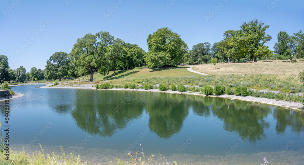 Fototapeta premium green shores of lake at urban park, Stuttagrt, Germany
