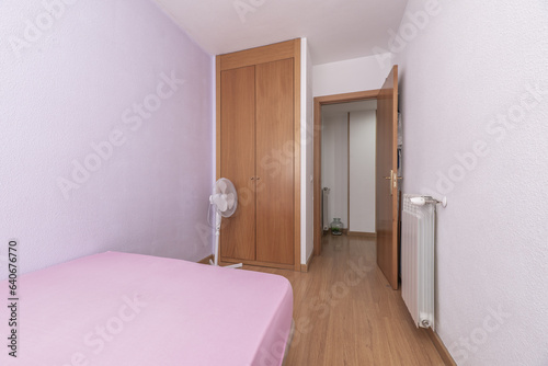 A small bedroom with few accessories