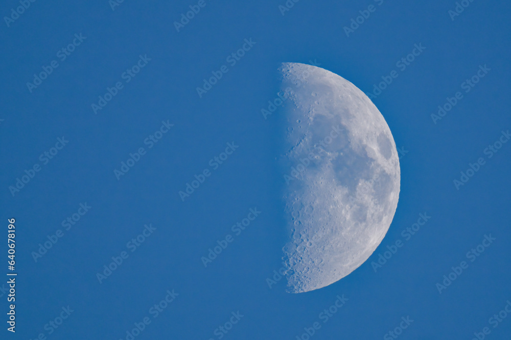 Beautiful half moon on the clear blue sky Beautiful half moon on the clear blue sky