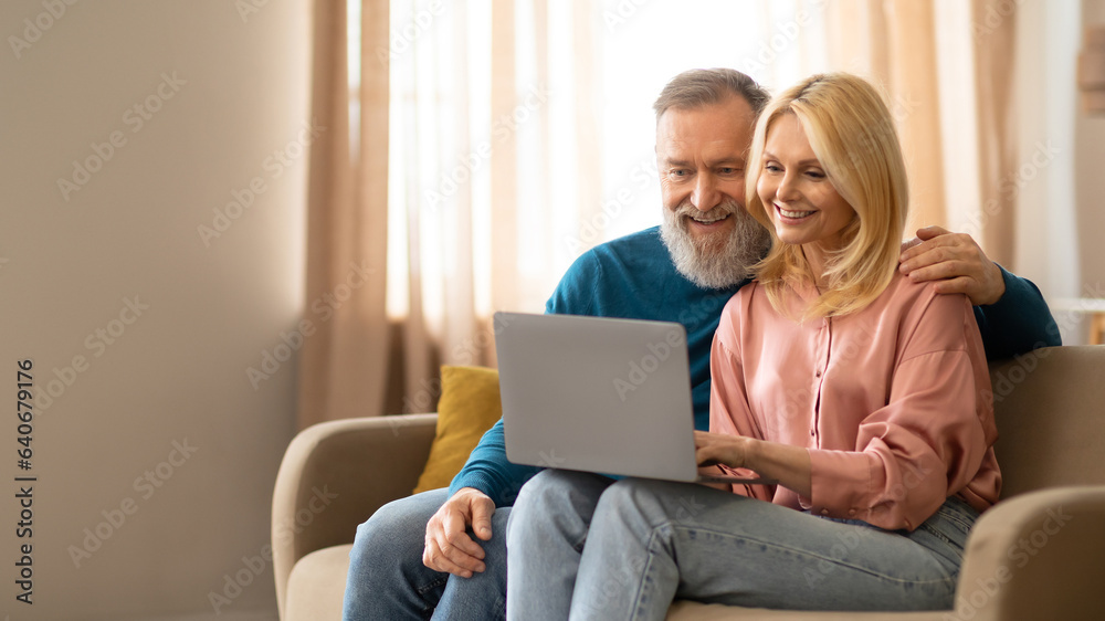 Joyful Senior Couple Video Calling Using Laptop, Communicating At Home Joyful Senior Couple Video Calling Using Laptop, Communicating At Home