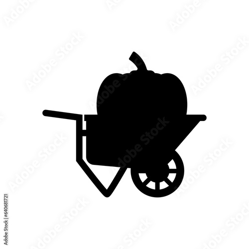 Big pumpkin inside a garden wheelbarrow. Vector silhouette.