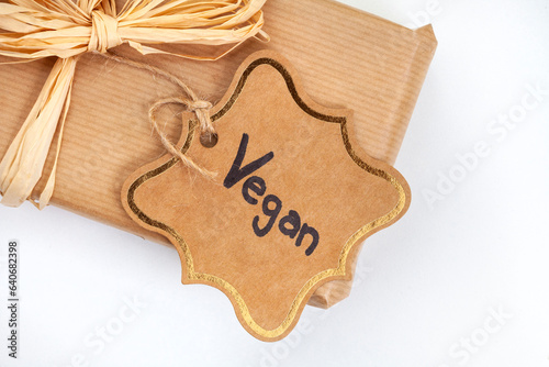 Rustic wrapped present with git tag written Vegan