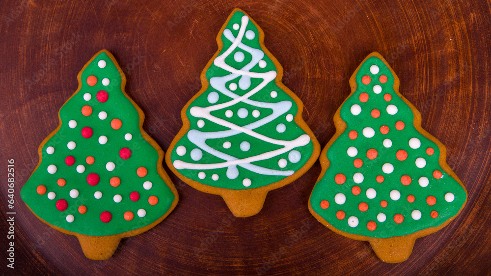 Christmas cookies in the shape of a Christmas tree on a wooden background