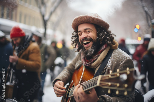 Cheerful street musicians performing in city park on snowy winter day. Performer playing a guitar. People gathering in the background.