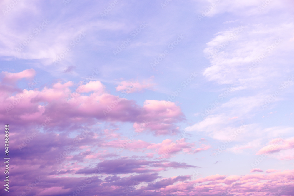 Sunrise Light Pink and Purple Clouds on Blue Sky