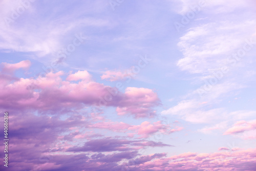 Sunrise Light Pink and Purple Clouds on Blue Sky © anya babii