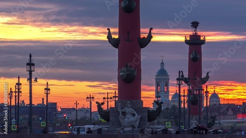 Sunset timelapse over Strelka - Spit of Vasilyevsky Island with Old Stock Exchange and Rostral Columns in Saint Petersburg, Russia, under a beautiful cloudy sky photo