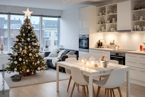 Modern light kitchen decorated Christmas tree. Home scandinavian interior