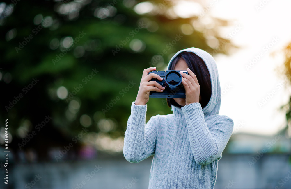 Take pictures with a mirrorless camera. Little girl practicing nature photography little photographer the joy of taking pictures Take pictures with a mirrorless camera. Little girl practicing nature photography little photographer the joy of taking pictures