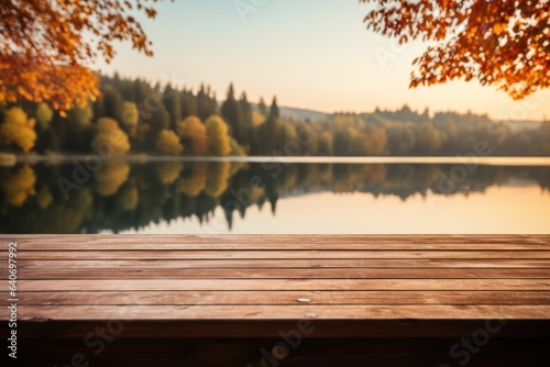 Autumn maple leaves on wooden table top. Falling leaves natural background. Sunny autumn day with beautiful orange fall foliage in the park. Generative AI © Natee Meepian