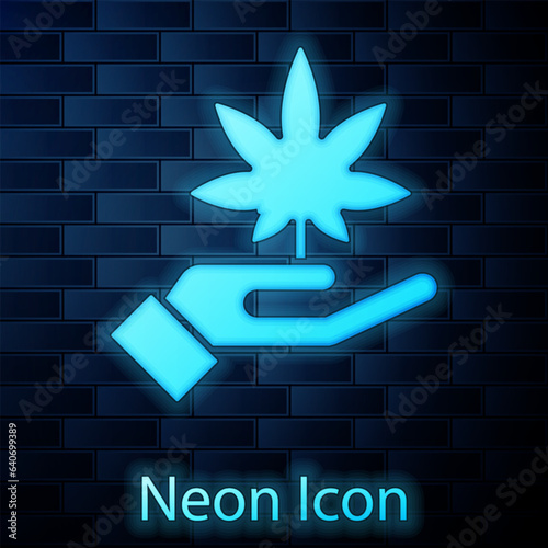 Glowing neon Medical marijuana or cannabis leaf icon isolated on brick wall background. Hemp symbol. Vector Illustration