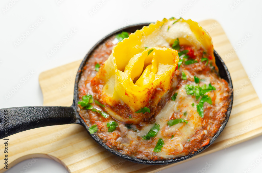 Hand rolled four cheese ravioli pasta in minced beef with Chianti red