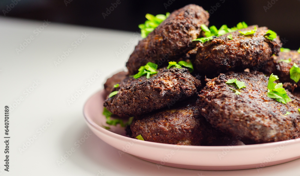 Fried minced cutlets served in a pile on a plate, typical eastern european homemade food Fried minced cutlets served in a pile on a plate, typical eastern european homemade food