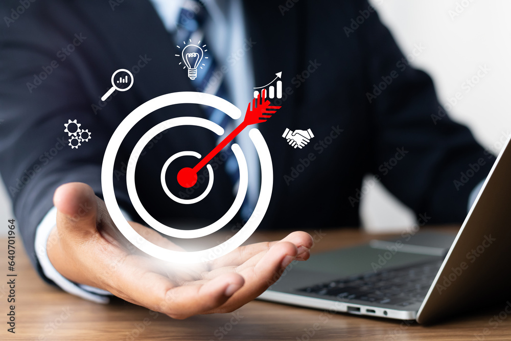 Concept of business strategy and future sustainable business finance action plan. Hand holding target board for creative and set up business objective target and success and business goals concept. Concept of business strategy and future sustainable business finance action plan. Hand holding target board for creative and set up business objective target and success and business goals concept.