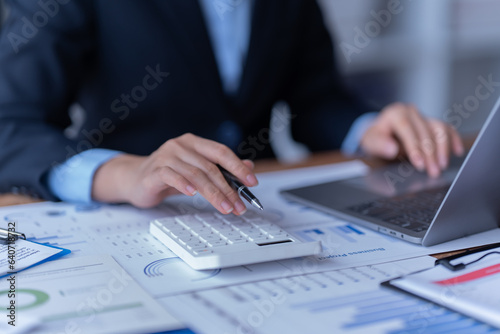 financial analysts analyze business financial reports planning investment project during a discussion at a meeting of corporate showing the results of their successful teamwork.