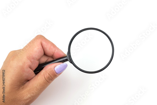 hand with a magnifying glass.