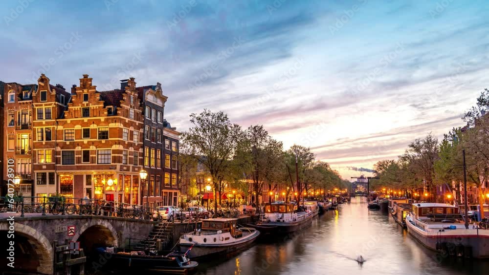 Amsterdam Netherlands time lapse 4K, city skyline day to night timelapse at canal waterfront