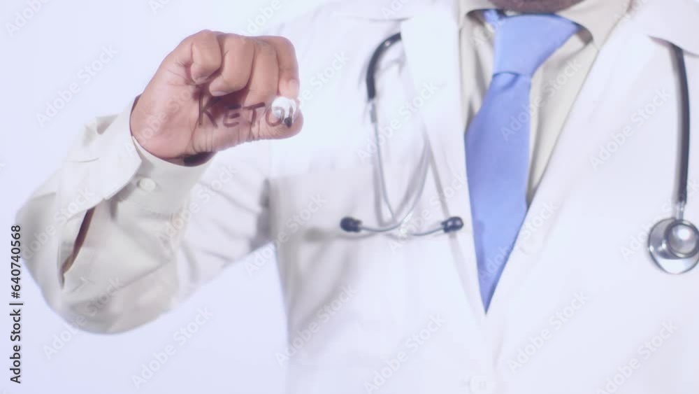 A medical doctor writes on the transparent glass words Ketones A medical doctor writes on the transparent glass words Ketones
