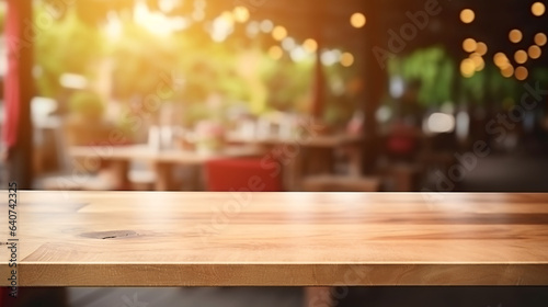 Empty wooden table for product display with blurred cafe background