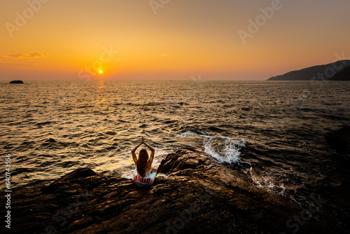 Fototapeta Naklejka Na Ścianę i Meble -  Sunset beach yoga in Goa India