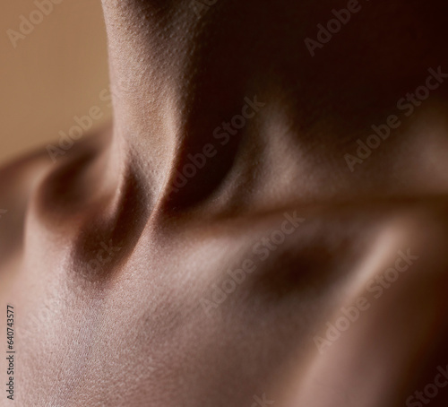 Skincare, beauty and closeup with neck of person in studio for health, textures and cosmetics. Wellness, body and aesthetic with zoom of woman on brown background for glow dermatology and glamour