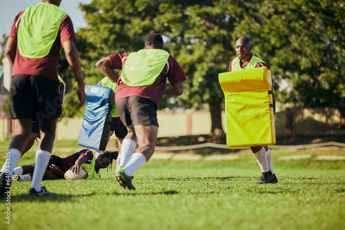 Sports, team and men for rugby training, workout and exercise on grass field for competition. Fitness, collaboration and athletes with equipment tackle for practice, match and game for challenge