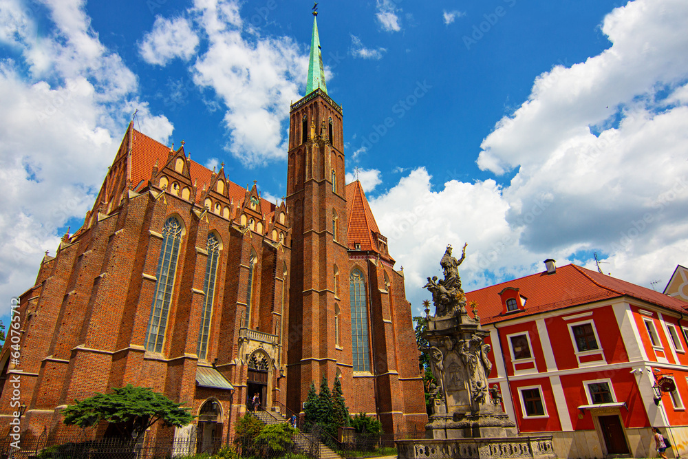 Collegiate Church of the Holy Cross and St. Bartholomew and Pastoral Center of the Archdiocese of Wroclaw on the Ostrow Tumski in Wroclaw, Poland. - obrazy, fototapety, plakaty 