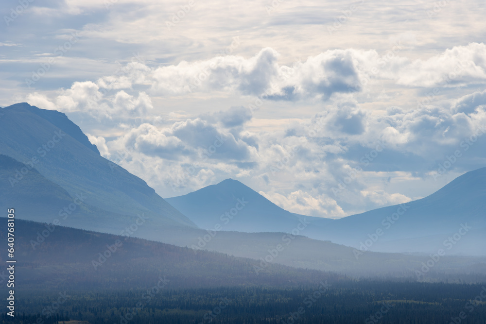 stunning mountain range in the distance, Yukon Territory, Canada stunning mountain range in the distance, Yukon Territory, Canada