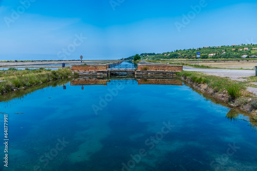 A view over water channel feeding pools at the salt pans at Secovlje, near to Piran, Slovenia in summertime