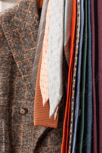 Wool jackets with ties on the rack.Shallow depth of field