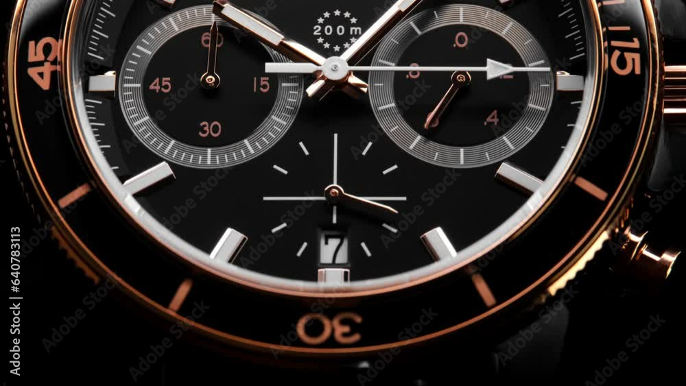 Second arrow running on the black clockface of luxury swiss watch with chronograph. Light flash on the turning clockface. Closeup real time shot. Running second arrow Second arrow running on the black clockface of luxury swiss watch with chronograph. Light flash on the turning clockface. Closeup real time shot. Running second arrow