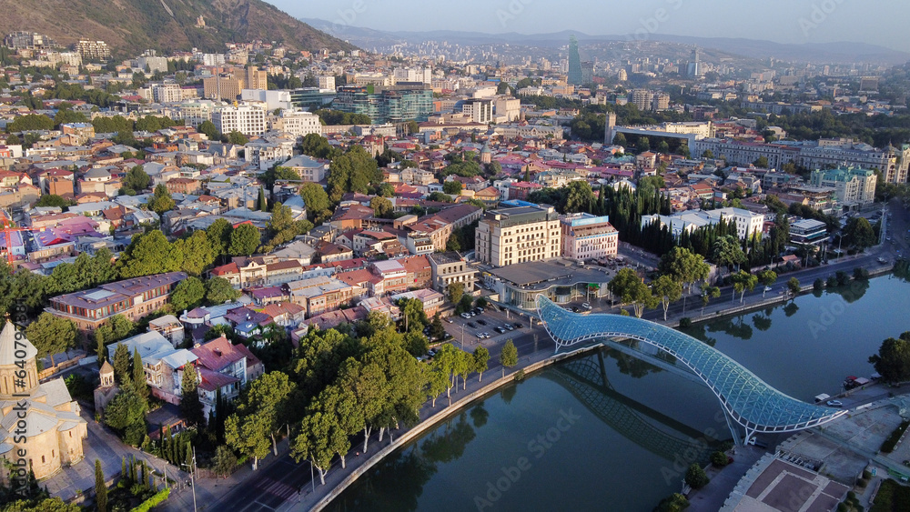 Aerial view on Peace bridge over Kura river and old town in Tbilisi