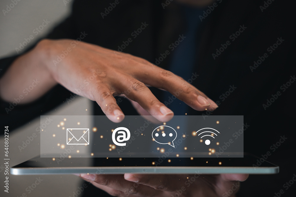 Naklejka premium Contact us or e-mail marketing concept on tablet, highlighting customer support hotline connections. Icons of email, phone call, and address represent communication. Banner online company interactions