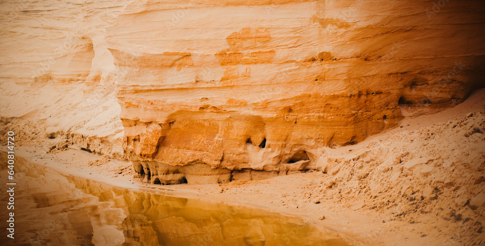 The sandy hills resembling canyons near a body of water. The essence of a summer vacation spent in beautiful locations. The natural wonders, outdoor recreation, and travel experiences. The sandy hills resembling canyons near a body of water. The essence of a summer vacation spent in beautiful locations. The natural wonders, outdoor recreation, and travel experiences.