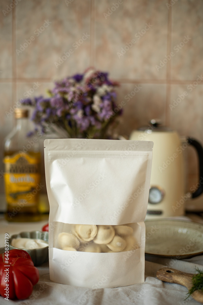 frozen dumplings in a zip bag without a brand. zip package with dumplings in the interior of the kitchen. frozen dumplings in a zip bag without a brand. zip package with dumplings in the interior of the kitchen.