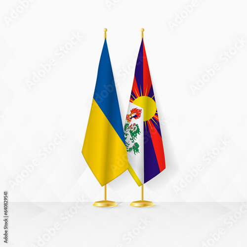 Ukraine and Tibet flags on flag stand, illustration for diplomacy and other meeting between Ukraine and Tibet.