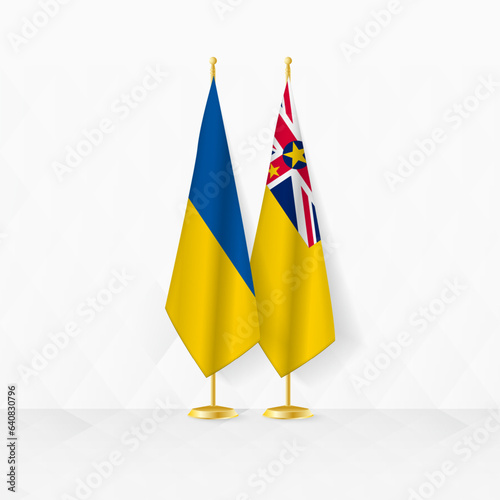 Ukraine and Niue flags on flag stand, illustration for diplomacy and other meeting between Ukraine and Niue.