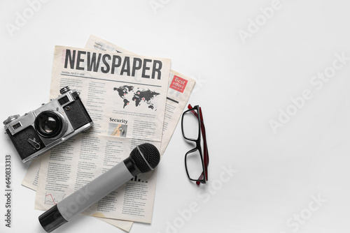 Newspaper with microphone, ...