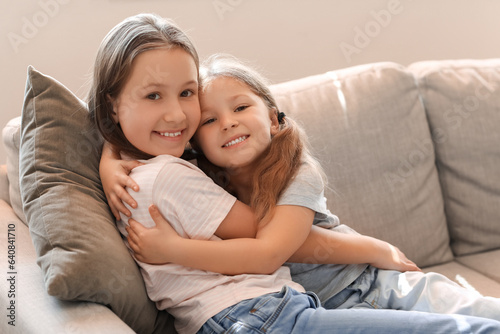 Cute little sisters hugging...