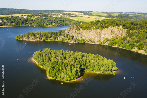 Aerial view of lake Sec with beautiful island. Famous tourist destination in Pardubicky kraj, Czech republic, European union.