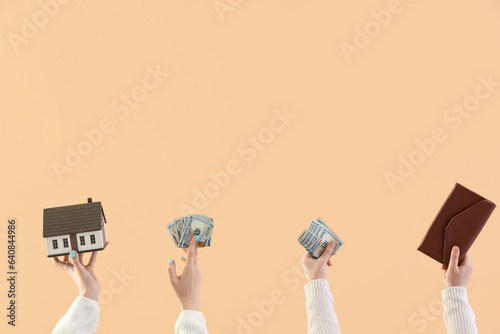 Women with house model, mon...
