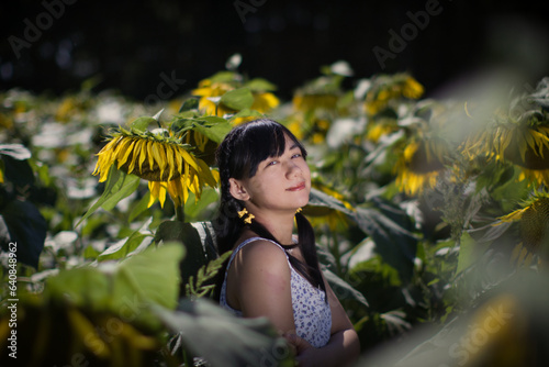 person in the garden with flowers sunflowers