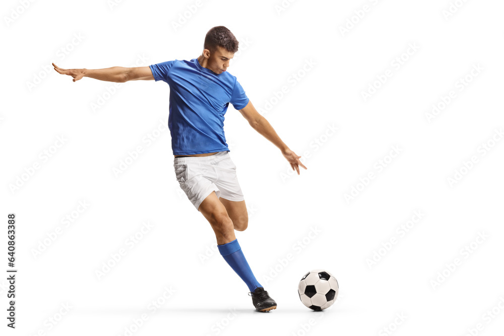 Football player in a blue jersey top running and preparing to kick a ball