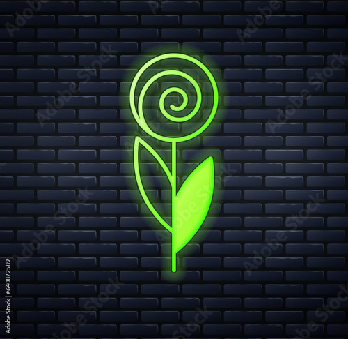 Glowing neon Flower icon isolated on brick wall background. 8 March. International Happy Women Day. Vector